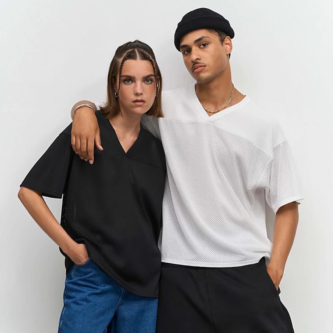 Camiseta deportiva vintage unisex de poliéster reciclado para merchandising corporativo sostenible