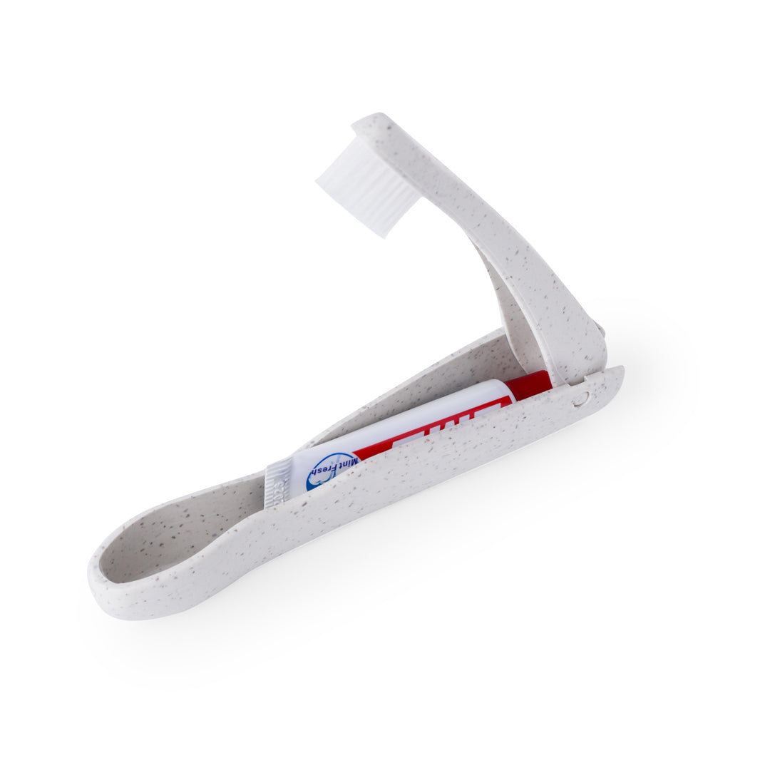 Cepillo de dientes plegable sostenible con compartimento y pasta de dientes de 6 gramos