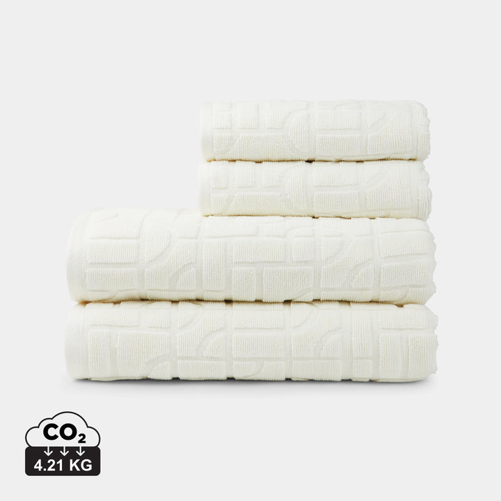 Set de toallas ecológicas personalizadas de algodón orgánico OCS para hoteles, clínicas y espacios wellness.